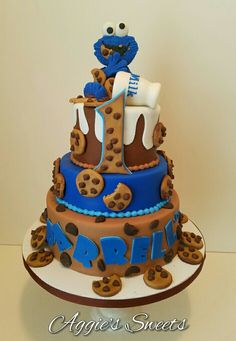 a blue and brown cake with cookie cookies on it