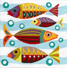 cross stitch pattern with colorful fish on blue and white striped background, in the shape of circles