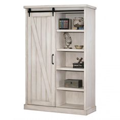 a white bookcase with sliding doors on the front and bottom shelves, open to reveal a bookshelf