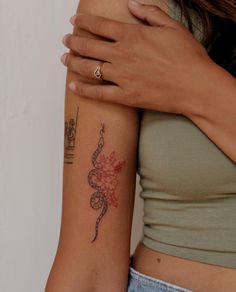 a woman with a tattoo on her arm