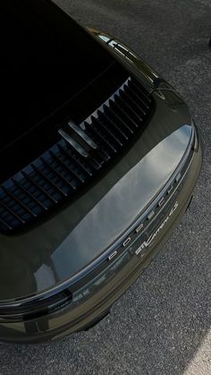 the front end of a green sports car