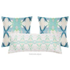 two pillows with blue and white designs on them