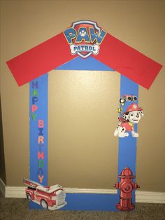 the paw patrol frame is made to look like a fire hydrant and dog house