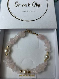 Natural Rose Quartz Gemstones, with Swarovski Pearls and 14 K Gold Filled Beads. Elegant, ladies bracelet. Rose Quartz is a soft feminine crystal that oozes pure love. It is thought to be a therapeutic stone and wearing it is believed to open the heart to all kinds of love including the love of self.  14k gold fill is  a superior option compared to gold plate in terms of durability, value, and resistance to wear and tear. It's a good choice for those looking for high-quality jewelry that can wit Rose Quartz Chip Bracelet, Rose Quartz Jewelry With Round Beads And Stones, Rose Quartz Beaded Jewelry With Stones, Rose Quartz Jewelry With Round Beads, Rose Quartz Beaded Crystal Bracelet As Gift, Elegant Hand-strung Rose Quartz Crystal Bracelet, Rose Quartz Gemstone Beaded Bracelets For Jewelry Making, Mineral Crystal Bracelet With Stones As Gift, Elegant Beaded Rose Quartz Crystal Bracelet