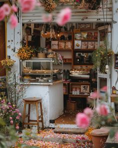 a flower shop filled with lots of flowers