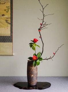 a vase with some flowers in it on a table