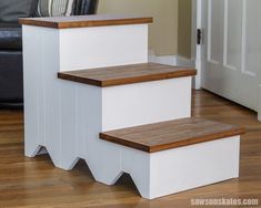 a set of white and wood stairs in a living room