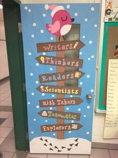 a classroom door decorated with an image of a pink bird on top of a sign