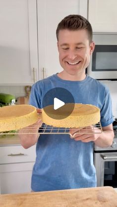 a man is holding two pans with food on them