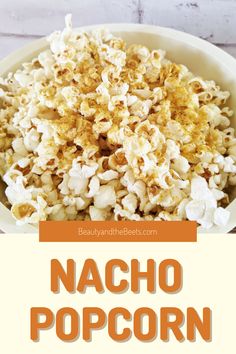 a bowl full of popcorn with the words nacho popcorn on it and an orange border