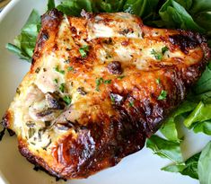 a close up of a plate of food with meat and greens on the side,