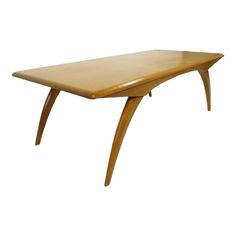 a wooden table with curved legs on an isolated white background