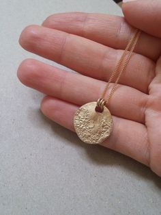 This 18K gold plated MOON necklace is perfect for your day to day life. You can customize by layering other dainty necklaces with it, or let it shine on its own. You can wear this full moon disc necklace all year round with your favorite sweater or sundress. Gold circle necklace is perfect for you, or as a gift for your loved ones! M A T E R I A L S  Pendant: 18K Gold plated Necklace: Gold-filled ❤ Want to see this necklace in silver? Click here: Click here: http://etsy.me/2psVvjt ❤ Want to see Delicate Yellow Gold Necklace With Moon Phase, Delicate Yellow Gold Moon Phase Necklace, Everyday Yellow Gold Plated Coin Necklace, 14k Gold-filled Yellow Gold Necklace With Moon Charm, Everyday Gold Coin Necklace, Delicate Gold Round Disc Jewelry, Gold Moon Phase Amulet Jewelry, Everyday Yellow Gold Moon Phase Necklace, Minimalist Yellow Gold Brass Coin Necklace