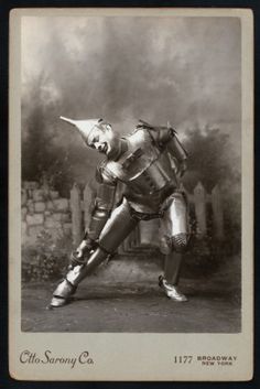 an old photo of a man in armor