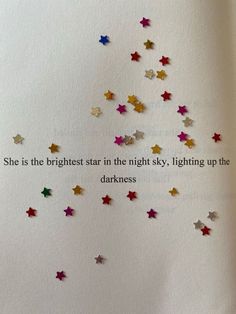 a book with some stars on it and a quote written in the bottom right corner