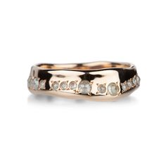 a gold ring with white diamonds on it