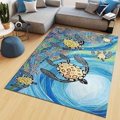 a living room area rug with turtle painting on the floor and couches in the background