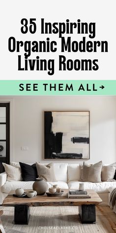 the living room is clean and organized with white couches, black pillows, and green accents