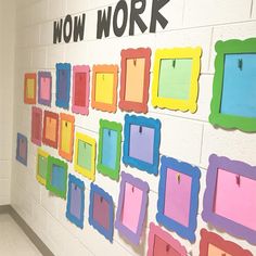 there are many different colored frames on the wall in this school hallway that says wow work