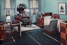 a bedroom with blue walls and furniture in the room, including a bed, desk, chair, dresser and mirror