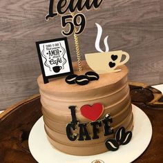 a cake that has been decorated with coffee and the words i love cafe on it