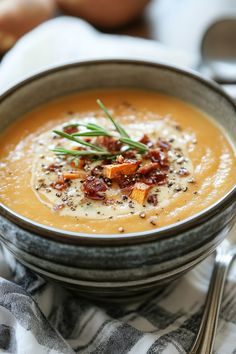 Creamy soup garnished with herbs and crispy bacon bits in a rustic bowl. Potato Soup Recipe, Soup And Stew, Sweet Potato Soup