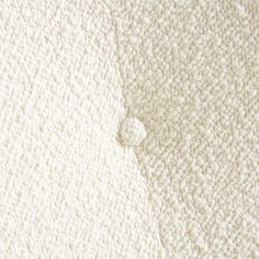 an up close view of the texture of a white carpet