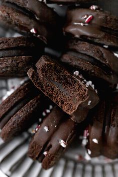 chocolate cookies with white sprinkles on a plate