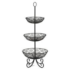 three tiered metal basket stand with wrought iron designs on the bottom and sides, black