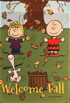 a welcome fall banner with charlie brown and his friends on the grass in front of a tree