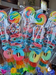 candy lollipops in cellophane bags are on display at a party