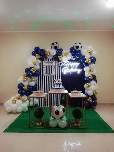 a soccer themed birthday party with balloons and decorations