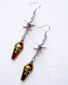 made from stained alloy metal with a size of 3 inches long and 2 cm in with. Nickel-free Metal Alternative Style Earrings, Alternative Style Nickel-free Metal Earrings, Nickel-free Metal Earrings In Alternative Style, Alternative Metal Earrings For Party, Edgy Metal Earrings With Ear Wire, Alternative Style Metal Earrings For Party, Edgy Halloween Jewelry, Alternative Metal Pierced Earrings, Gothic Wire Wrapped Metal Jewelry