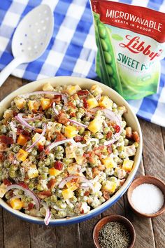 a bowl filled with rice and vegetables next to a bag of flour