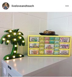 a yellow lighted palm tree on top of a white counter