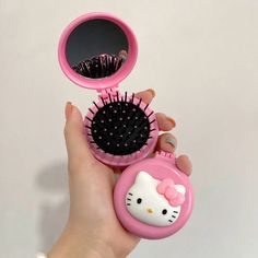 a hello kitty hair brush in a pink case