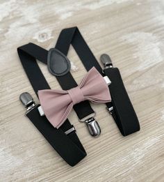 Your special guy will look so handsome when he shows up in his Dusty Mauve bow tie  and Black suspenders!  Great set for groomsman, best man or ring bearers - This bow tie & suspenders set is a great choice for family photos, wedding, ring bearer outfit, birthday celebration or any other special occasion.  When making a purchase, you can choose from the following options : -Suspenders Only -Bow Tie Only. -Suspenders + Bow Tie Set. Attention ! We Will not accept any  returns based upon color disc Elegant Suspenders For Party Suit Accessories, Classic Suspenders For Suit And Tie At Party, Classic Wedding Belts And Suspenders With Bow Tie, Classic Bow Tie With Suspenders For Party, Classic Party Bow Tie With Suspenders, Elegant Adjustable Belts And Suspenders For Wedding, Elegant Party Belt With Bow, Elegant Adjustable Belts And Suspenders For Black Tie, Elegant Formal Belts And Suspenders With Ties