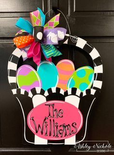 a door hanger with an image of the williamss on it