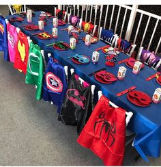 the table is set up with superhero capes