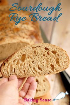 a hand holding a piece of bread with the words sourdough rye bread on it