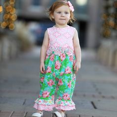 Your little baby will look gorgeous in this romper! Featuring an original Pink and Green floral print and a contrasting Arabesque print. Pretty rose flowers at the waist. Sleeveless romper with snap closures behind the neckline. Snaps at inseam for easy changing and dressing. Finished with two gathered ruffles at ankles. The 95% high quality Egyptian cotton and 5% stretchy lycra fabric is SUPER soft and comfortable. Premium dye's ensure that your outfit won't fade or run. Machine Washable. Style Spring Rose, Toddler Jumpsuit, Spring Roses, Toddler Romper, Jumpsuit Summer, Baby Easter, Ruffle Romper, Spring Baby