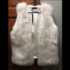 New With Tags! Purchased From Urban Outfitters. Faux Fur With Hook And Eye Front Closure. Very Fluffy And Very Cute. Pink Gucci Purse, White Fur Vest, Faux Shearling Vest, Gucci Purse, Motorcycle Vest, Shearling Vest, Faux Fur Vests, Hook And Eye, White Faux Fur