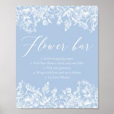 a blue and white flower bar sign with the words flower bar written in cursive font