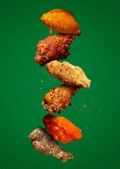 an image of food falling into the air on a green background with space for text