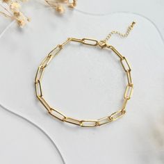 -gold filled paperclip bracelet, gold chain bracelets for women, dainty chain bracelet- If you are interested in placing a bulk order (50+ pieces), please message us for special pricing. ► DETAILS  -14K gold filled paperclip chain -7 lengths available: * 5 inches- 12.7 cm * 6 inches- 15.2 cm * 7 inches- 17.8 cm * 8 inches- 20.3 cm * 9 inches- 22.9 cm * 10 inches- 25.4 cm * 11 inches- 27.9 cm Each bracelet comes with a 2-inch extender, allowing you to adjust the length. ►Heavenly Materials Our je Gold-tone 14k Gold Paperclip Bracelet Gift, Elegant Gold-plated Paperclip Bracelet With Gold Chain, Gold-plated Yellow Gold Paperclip Bracelet, Classic Gold-tone Paperclip Bracelet With Adjustable Chain, Gold-plated Yellow Gold Bracelet With Paperclip Chain, Bracelet For Women Gold, Paperclip Bracelet, Bracelet For Her, Gold Armband