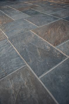 an image of a stone floor that looks like it is made out of slate tiles