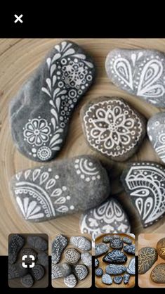 some rocks are sitting on a table and there is an image of them with different designs