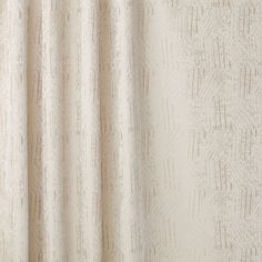 a close up view of a white curtain with brown lines on the outside and inside