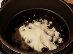 a pot filled with white stuff on top of a stove