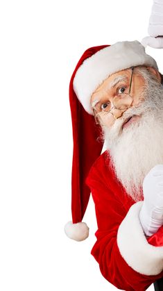 a man dressed as santa claus is holding something in his hand